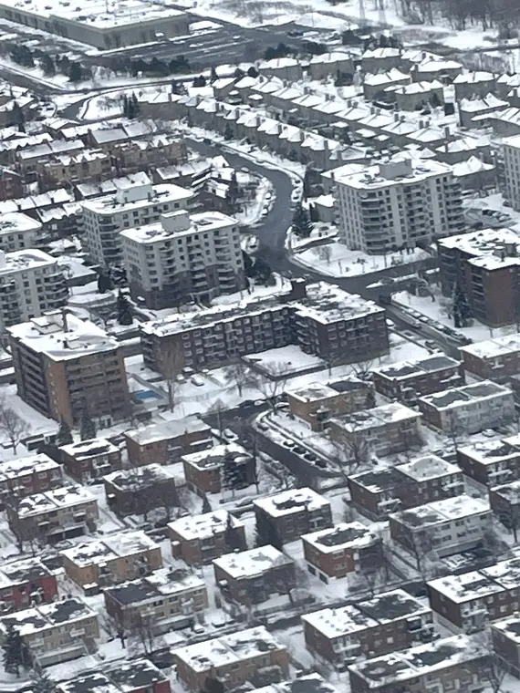 Aerial view of city blocks after snowfall