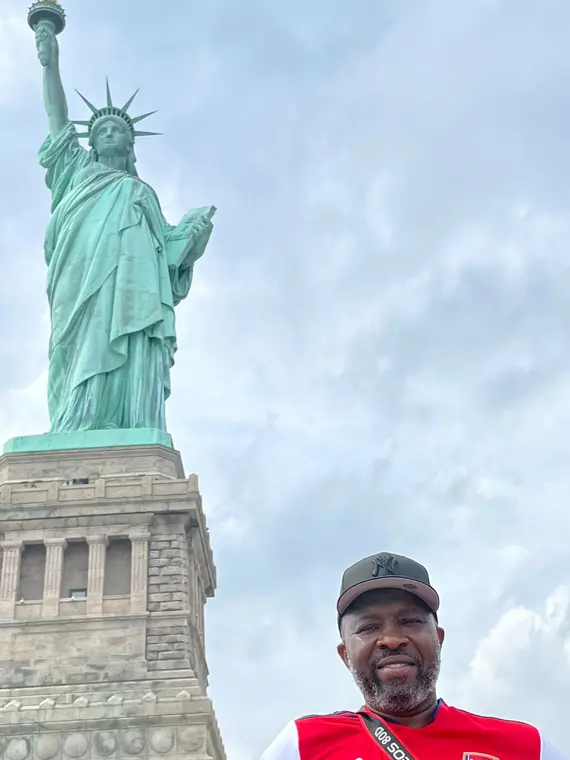 Portrait with the Statue of Liberty in the background